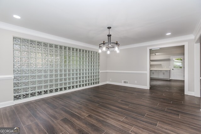 247 Old Timber Rd, Lawrenceville, GA 30046 - unfurnished dining area featuring wood finish floors, crown molding, a chandelier, and visible vents
