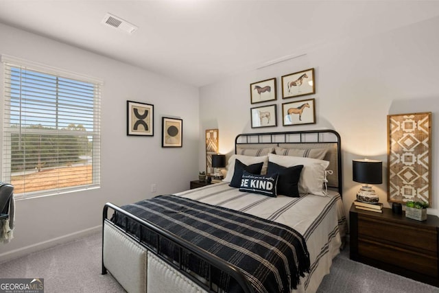 bedroom featuring carpet flooring, baseboards, and visible vents