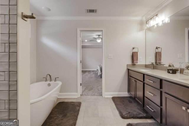 3065 Meadow Springs Dr, Watkinsville, GA 30677 - bathroom featuring double vanity, a freestanding tub, ceiling fan, ornamental molding, and ensuite bath