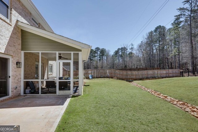 3065 Meadow Springs Dr, Watkinsville, GA 30677 - fenced backyard with a sunroom, a patio area, and ceiling fan