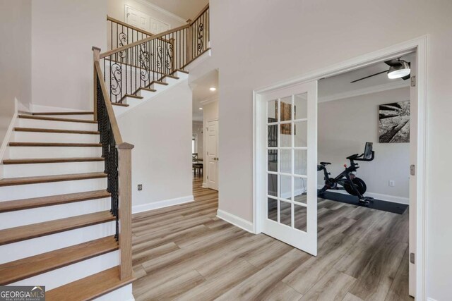 3065 Meadow Springs Dr, Watkinsville, GA 30677 - foyer with wood finished floors, stairs, ornamental molding, and a towering ceiling