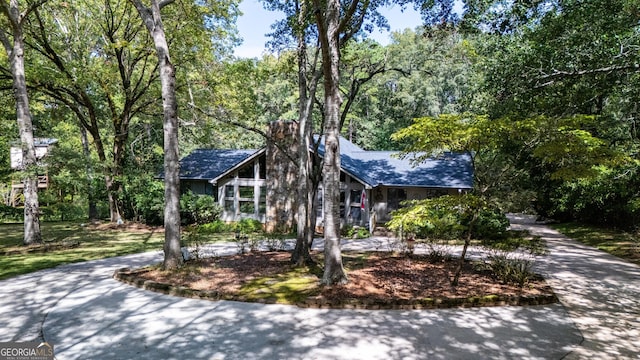 4004 White Oak Ln, Lagrange, GA 30240 - view of front of property with a forest view, curved driveway, and roof with shingles
