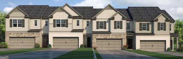 townhome / multi-family property featuring stone siding and board and batten siding