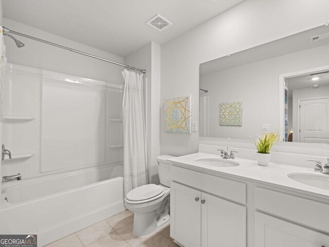 full bathroom featuring shower / bath combination with curtain, tile patterned floors, a sink, and visible vents
