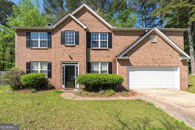 5330 Willow Park Blvd, South Fulton, GA 30349 - view of front facade with driveway, an attached garage, a front lawn, and brick siding