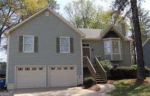 view of front of house featuring an attached garage and driveway