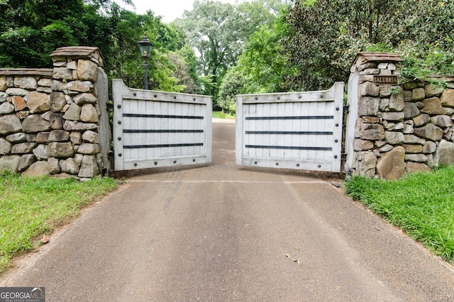 2100 W Wesley Rd, Atlanta, GA 30327 - gate with view of wooded area