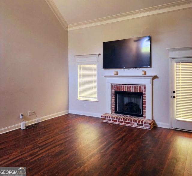 unfurnished living room featuring baseboards, ornamental molding, hardwood / wood-style floors, and a fireplace