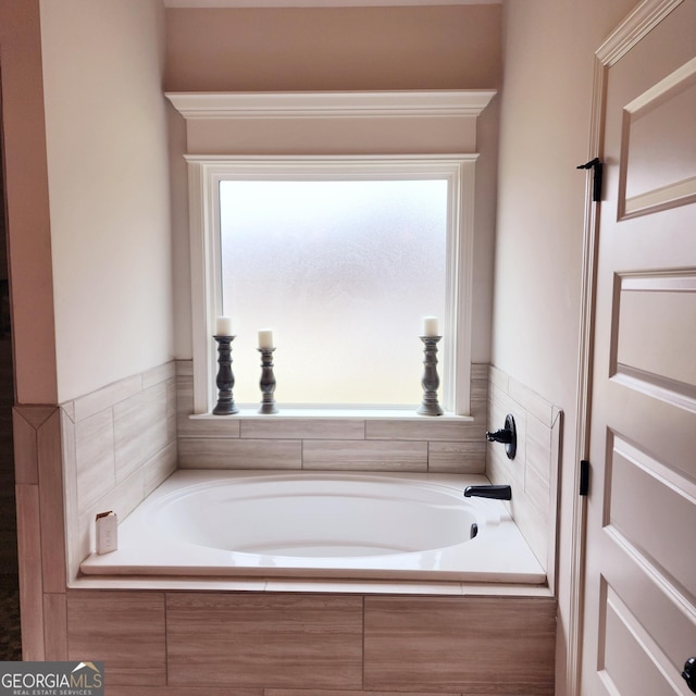 bathroom with a garden tub