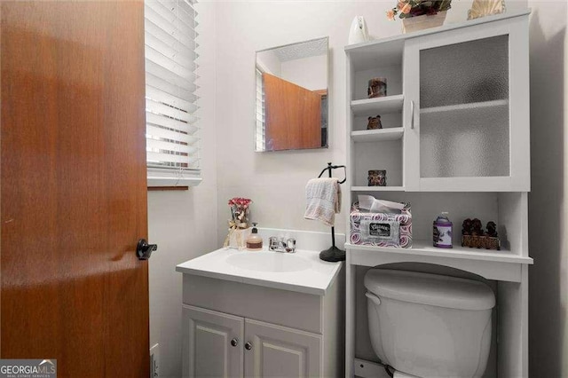 bathroom with vanity and toilet