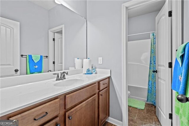 full bath featuring shower / bath combination with curtain, toilet, and vanity