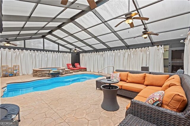 view of swimming pool featuring fence, a patio, an outdoor living space, glass enclosure, and ceiling fan