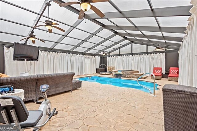 outdoor pool featuring a fenced backyard, glass enclosure, ceiling fan, an in ground hot tub, and a patio area