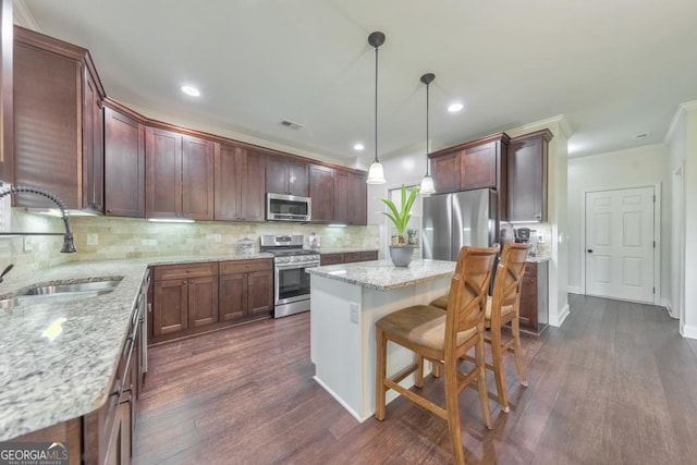 64 Durana Way, Dallas, GA 30132 - kitchen featuring stainless steel appliances, ornamental molding, tasteful backsplash, a center island, and dark wood-style floors
