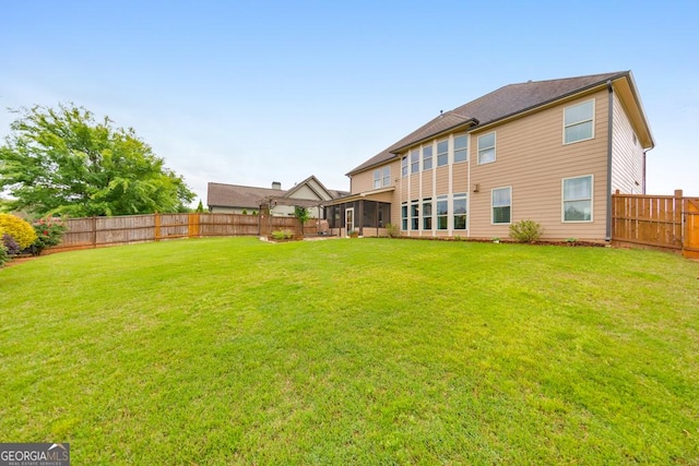 64 Durana Way, Dallas, GA 30132 - back of property with a sunroom and a fenced backyard