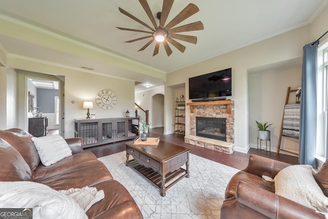 64 Durana Way, Dallas, GA 30132 - living area with ceiling fan, arched walkways, stairway, wood finished floors, and a fireplace