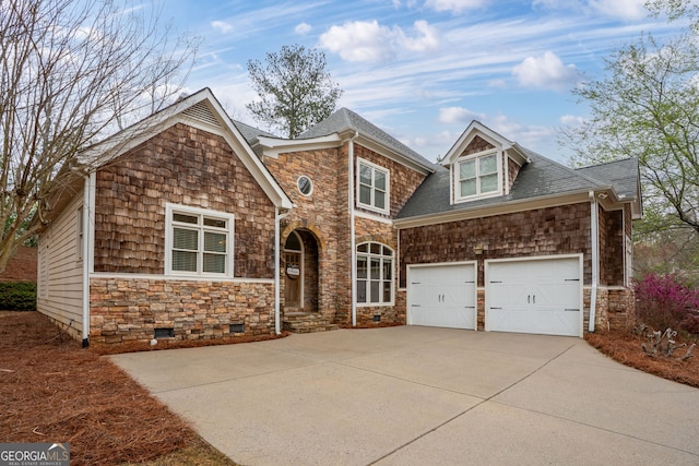 view of front facade featuring a garage, crawl space, stone siding, a shingled roof, and driveway