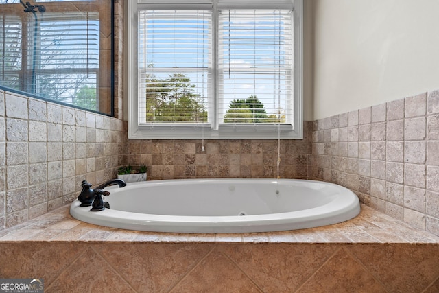 bathroom with a garden tub