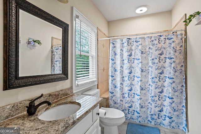 bathroom with toilet, shower / tub combo, vanity, and tile patterned flooring