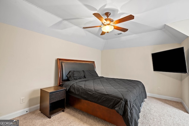 bedroom with visible vents, baseboards, ceiling fan, light carpet, and lofted ceiling