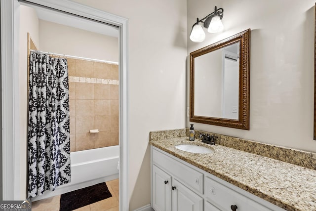 bathroom featuring shower / tub combo and vanity