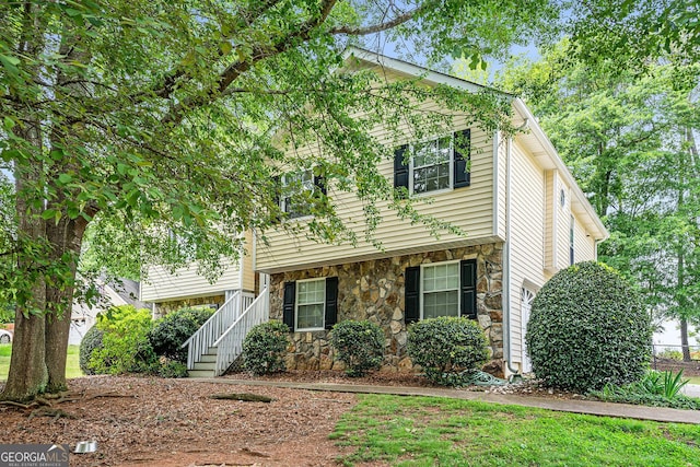 view of front facade featuring stone siding
