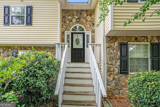 view of exterior entry with stone siding