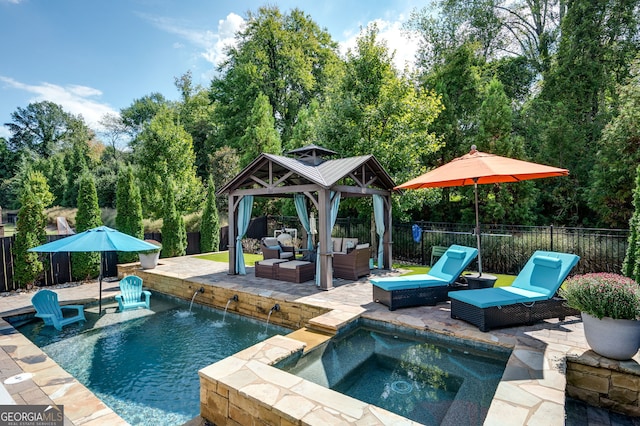 319 Riverton Way, Woodstock, GA 30188 - view of pool featuring an outdoor hangout area, an in-ground hot tub, a gazebo, a fenced backyard, and a patio
