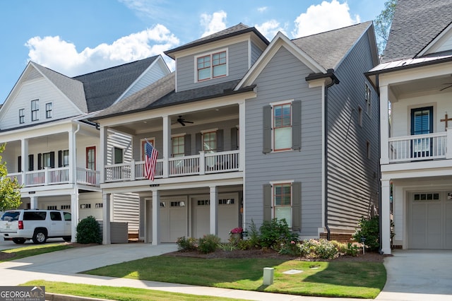 319 Riverton Way, Woodstock, GA 30188 - view of front of home with concrete driveway, an attached garage, a balcony, ceiling fan, and a shingled roof
