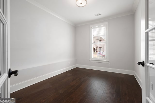 319 Riverton Way, Woodstock, GA 30188 - unfurnished room with baseboards, ornamental molding, and dark wood-style flooring