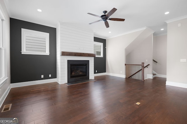 319 Riverton Way, Woodstock, GA 30188 - unfurnished living room with ceiling fan, crown molding, wood finished floors, baseboards, and a large fireplace