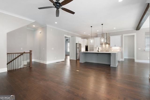 319 Riverton Way, Woodstock, GA 30188 - unfurnished living room with ceiling fan, baseboards, dark wood-style floors, recessed lighting, and crown molding