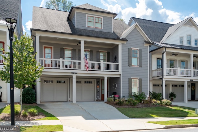 319 Riverton Way, Woodstock, GA 30188 - view of front facade with an attached garage, a balcony, and ceiling fan