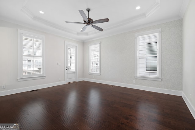 319 Riverton Way, Woodstock, GA 30188 - spare room featuring a tray ceiling, ornamental molding, dark wood-type flooring, ceiling fan, and baseboards