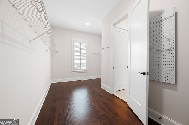 319 Riverton Way, Woodstock, GA 30188 - spacious closet featuring wood finished floors