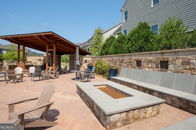 319 Riverton Way, Woodstock, GA 30188 - view of patio / terrace with an outdoor fire pit