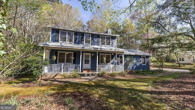 105 Homeport Dr, Newnan, GA 30265 - view of front of home with a porch and a chimney