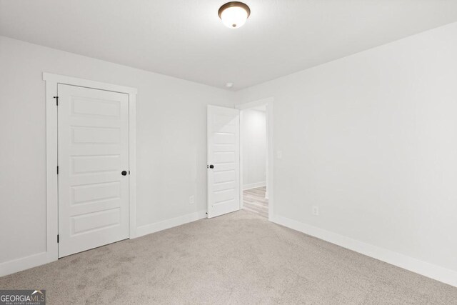 445 Liberty Hill Rd Unit 22, Hartwell, GA 30643 - unfurnished bedroom with baseboards and carpet floors