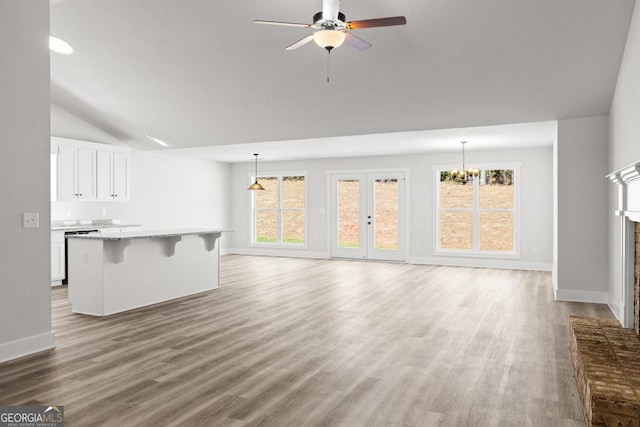 445 Liberty Hill Rd Unit 22, Hartwell, GA 30643 - unfurnished living room with ceiling fan with notable chandelier, baseboards, and wood finished floors