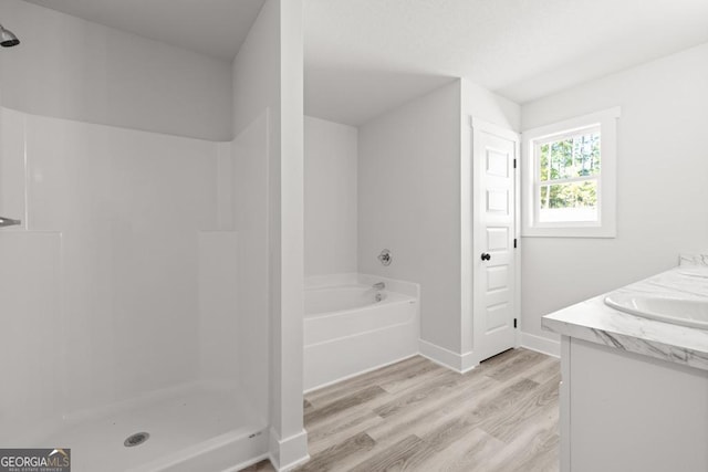 445 Liberty Hill Rd Unit 22, Hartwell, GA 30643 - bathroom featuring a bath, a shower, baseboards, wood finished floors, and vanity