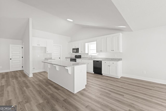 445 Liberty Hill Rd Unit 22, Hartwell, GA 30643 - kitchen featuring white cabinetry, a breakfast bar, a center island, lofted ceiling, and black appliances