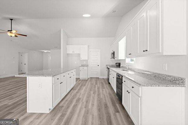 445 Liberty Hill Rd Unit 22, Hartwell, GA 30643 - kitchen featuring white cabinets, ceiling fan, stainless steel appliances, a sink, and vaulted ceiling