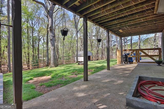 view of patio featuring an outbuilding