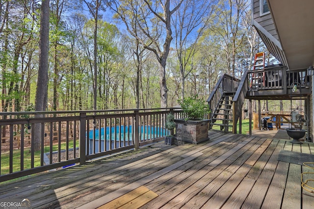 wooden deck featuring stairway