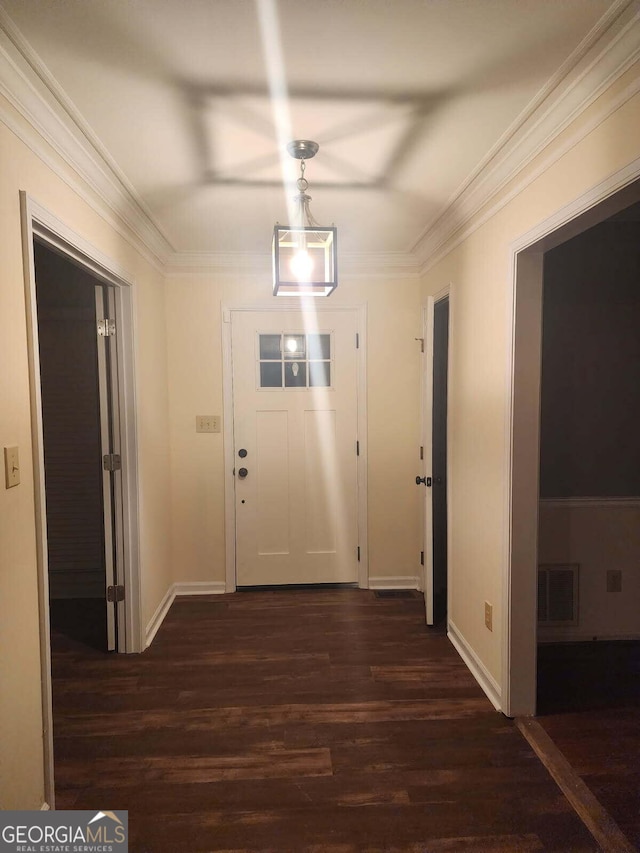 corridor featuring dark wood-style floors, visible vents, and baseboards