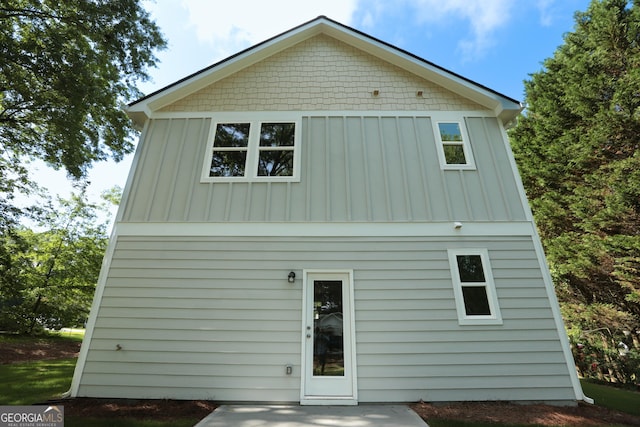 113 Sharp St, Bremen, GA 30110 - back of house with board and batten siding and a patio