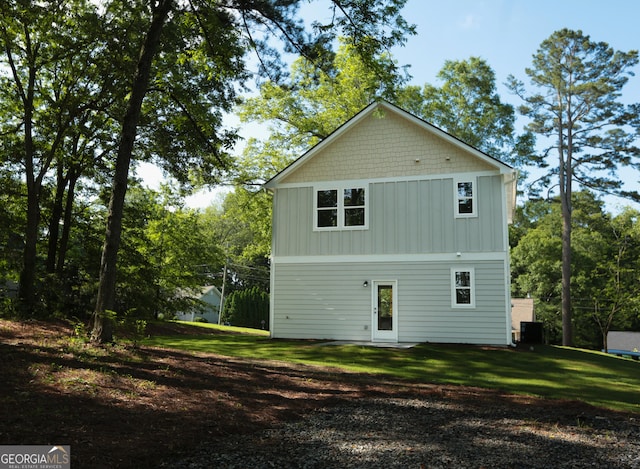 113 Sharp St, Bremen, GA 30110 - back of house with board and batten siding, a yard, and cooling unit