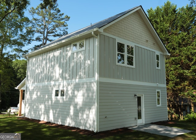 113 Sharp St, Bremen, GA 30110 - view of side of property featuring board and batten siding and a patio area