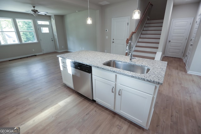 113 Sharp St, Bremen, GA 30110 - kitchen featuring stainless steel dishwasher, a sink, a ceiling fan, light wood finished floors, and white cabinetry