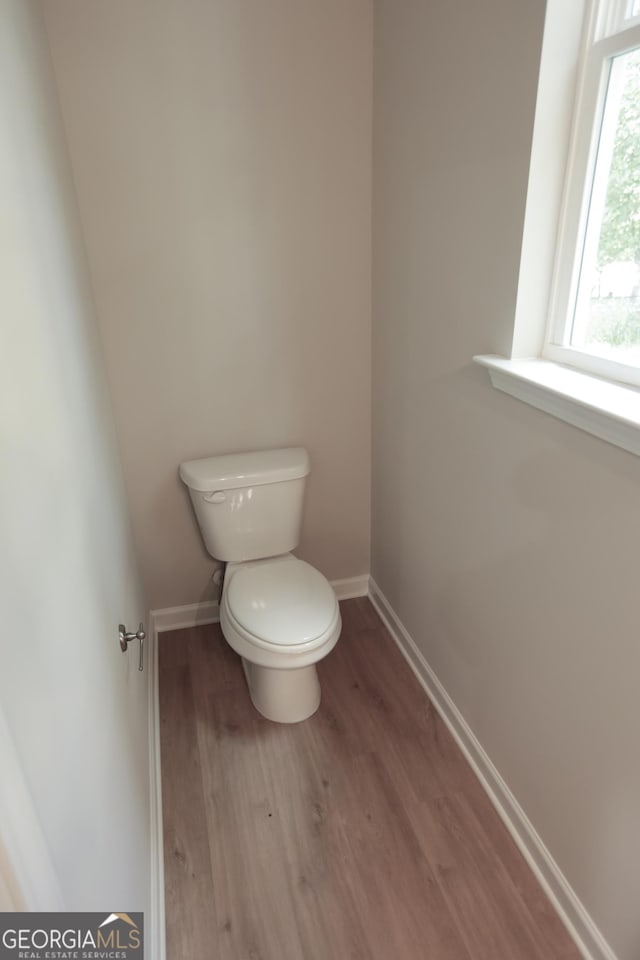 113 Sharp St, Bremen, GA 30110 - bathroom featuring wood finished floors, toilet, and baseboards